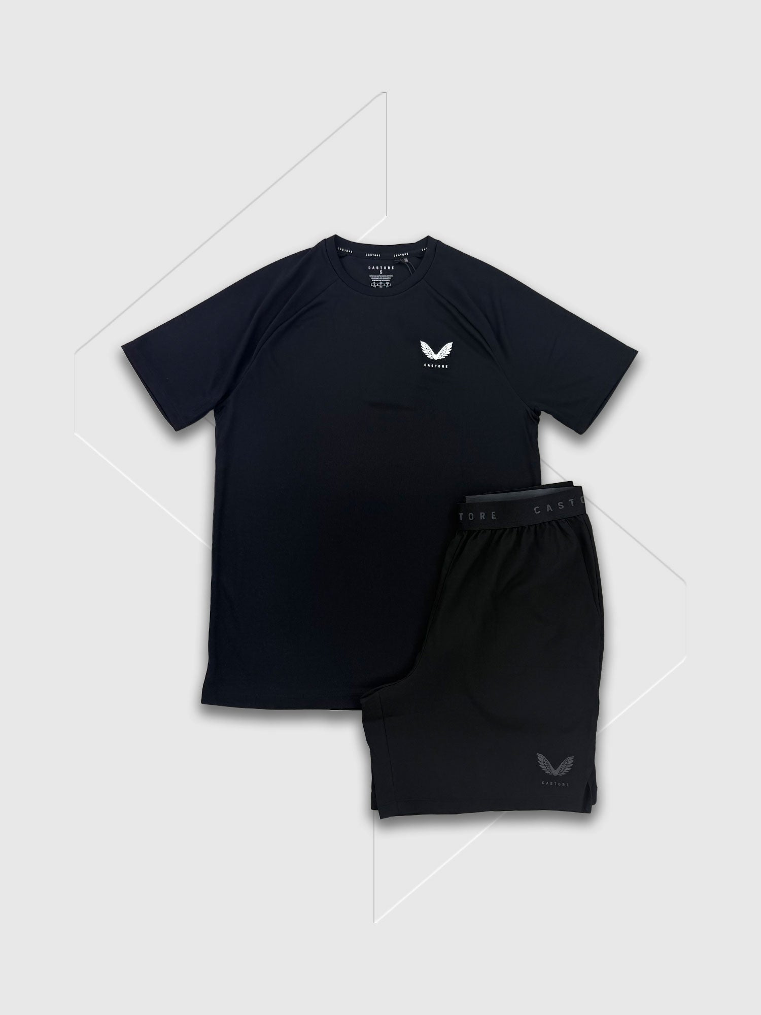 Castore Adapt Training Branded Elastic T-Shirt/Short Set Black/White/Black from Saxumo.com